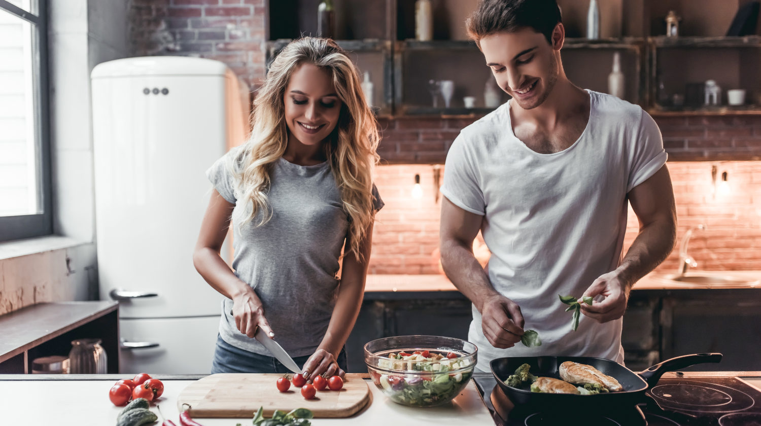 Feature | Attractive couple cooking on kitchen | Most Nutritious Foods to Add to Your Diet
